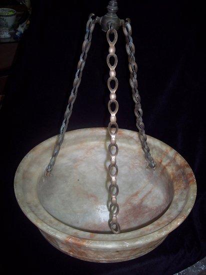 Appraisal: An alabaster ceiling bowl of circular moulded form hung from