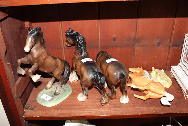 Appraisal: A GROUP OF THREE BESWICK SHIRE HORSES each in a