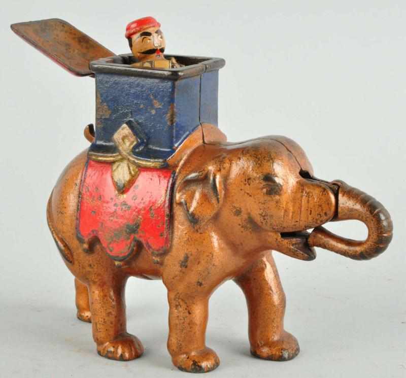 Appraisal: Cast Iron Elephant with Howdah Mechanical Bank Description Working Condition