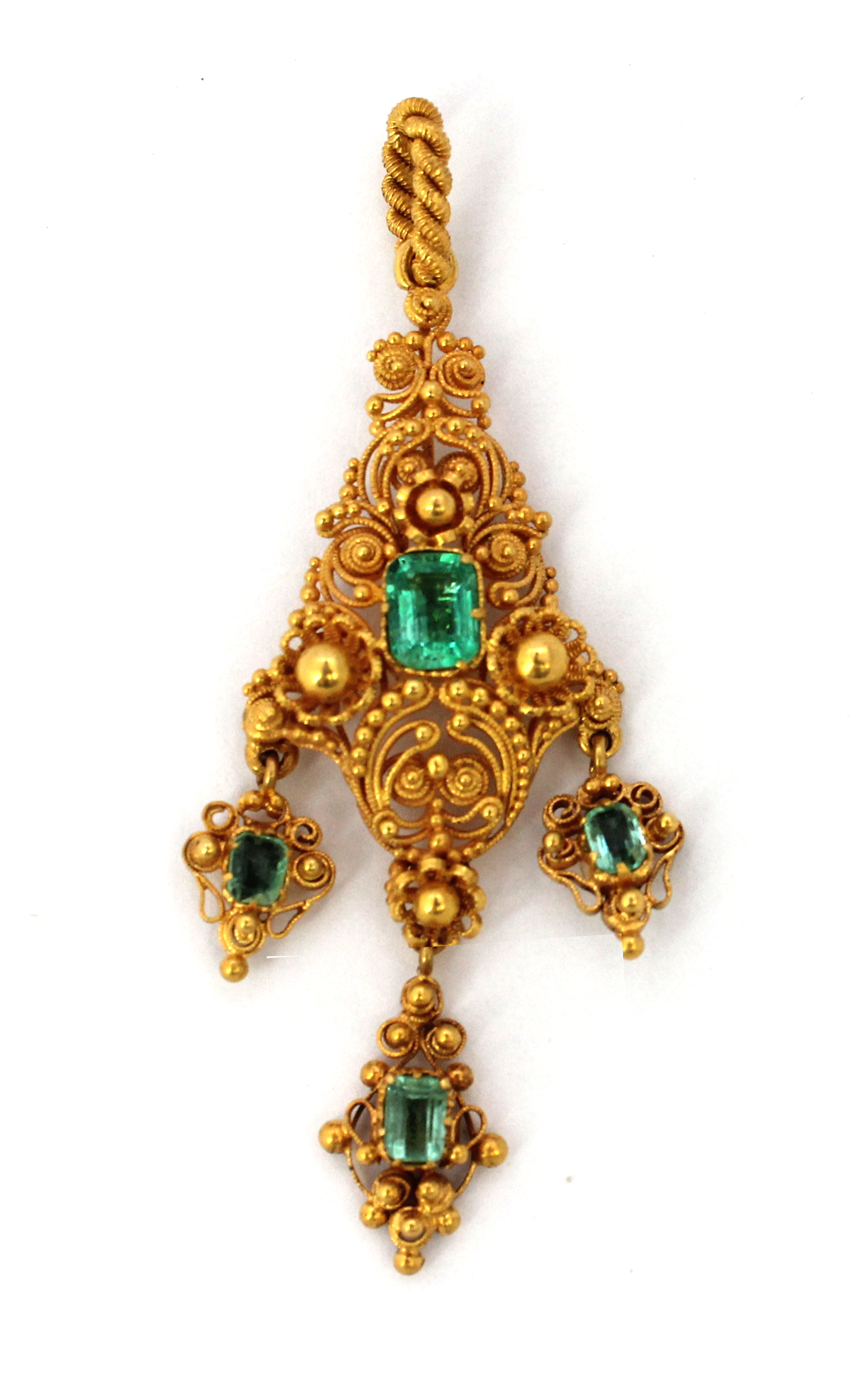 Appraisal: A gold and foil backed emerald set pendant in a