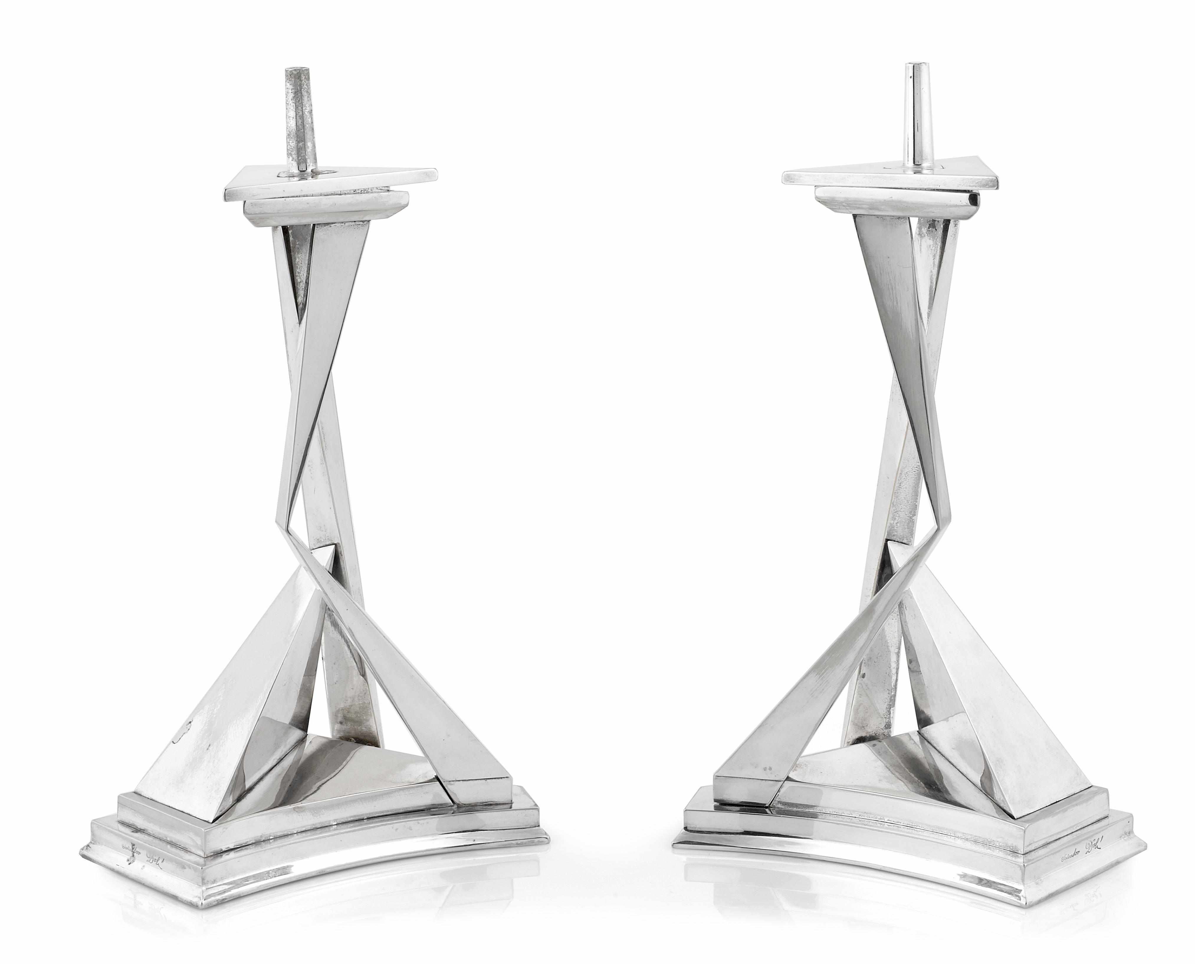 Appraisal: A pair of Salvador Dali chromium plated metal pricket candlesticks