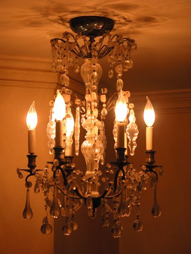 Appraisal: Title -arm chandelier with crystal drops and silver plate arms