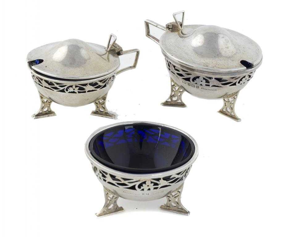 Appraisal: A PAIR OF GEORGE V MUSTARD POTS AND A SALT