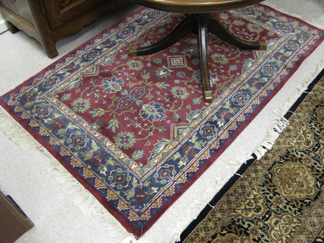 Appraisal: HAND KNOTTED ORIENTAL AREA RUG Indo-Persian overall stylized floral design