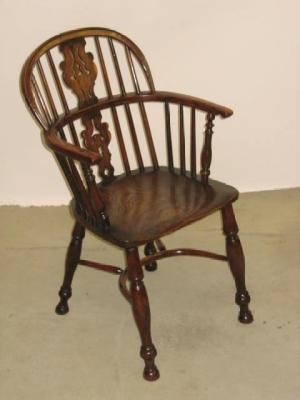 Appraisal: A YEW WINDSOR ARMCHAIR of double hoop back form with