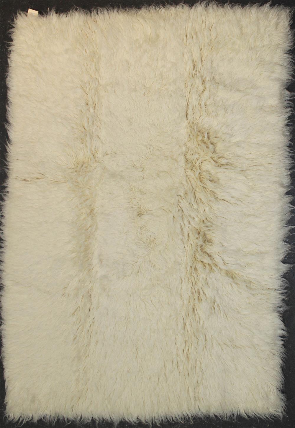 Appraisal: FLOKATI NATURAL WOOL RUG approx ' x '