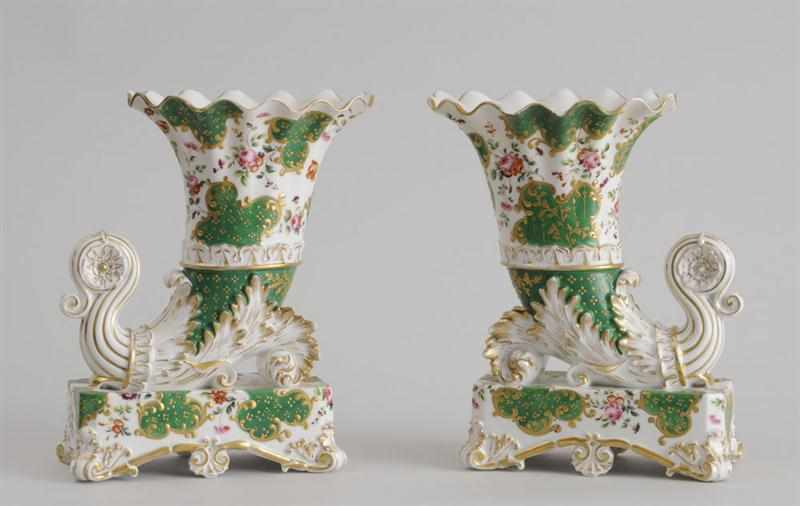 Appraisal: PAIR OF JACOB PETIT GREEN-GROUND PORCELAIN CORNUCOPIA VASES Each marked