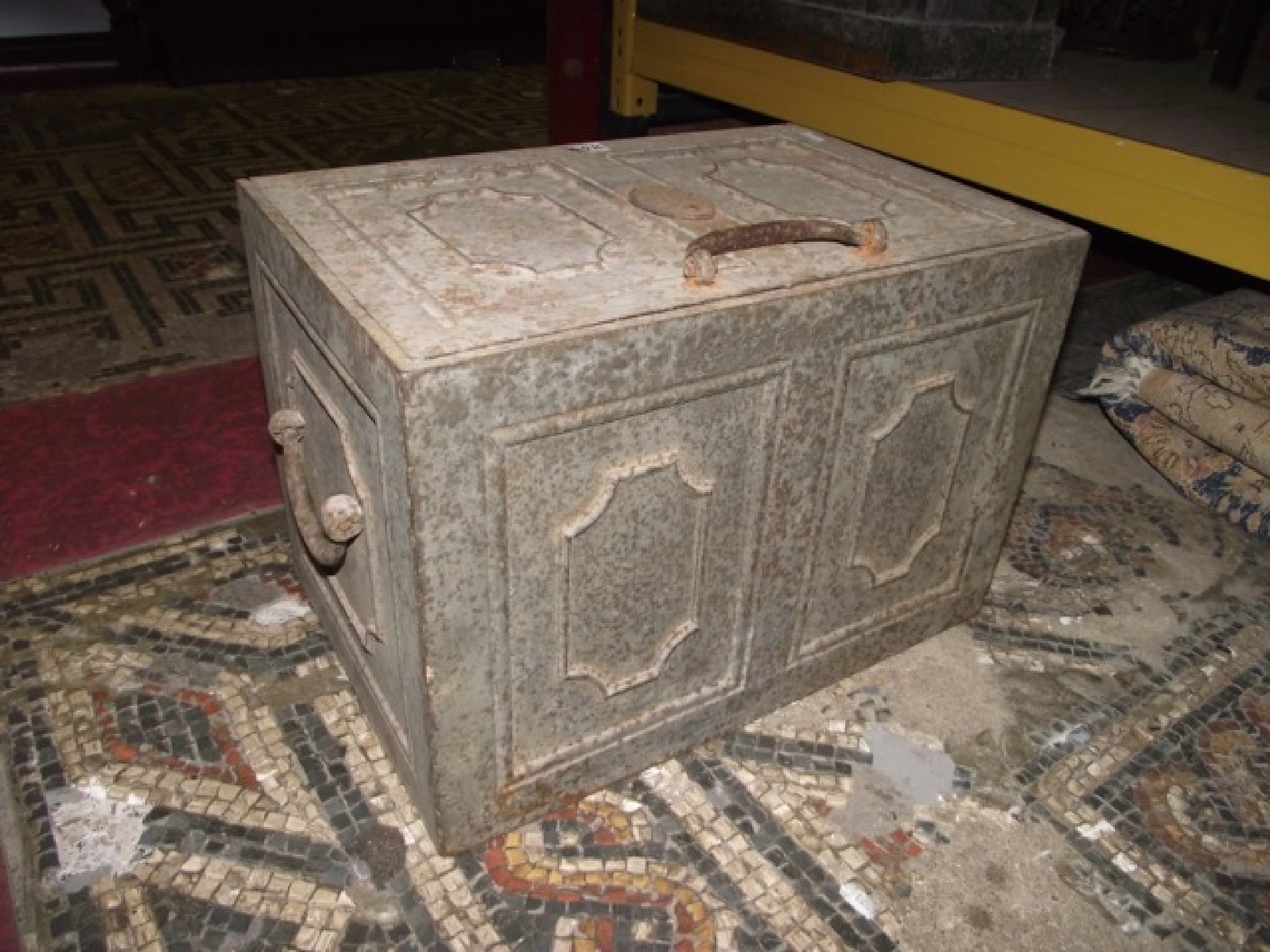 Appraisal: A th century cast iron strongbox safe with side carrying