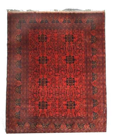 Appraisal: A TURKOMAN RED GROUND CARPET - decorated an all over