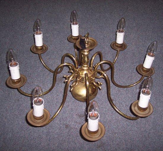 Appraisal: Four gilt brass eight-light chandeliers each issuing eight scroll arms