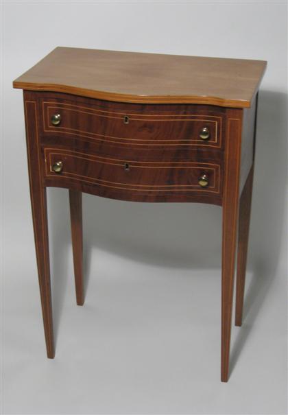 Appraisal: Swell front mahogany Federal style end table th century The