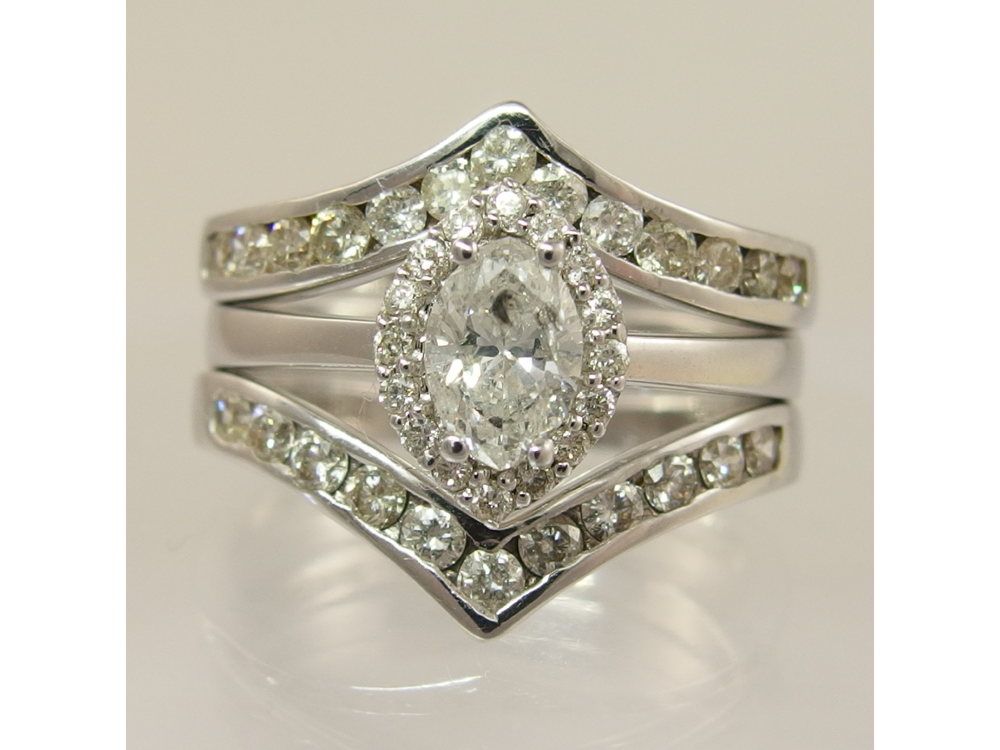 Appraisal: An unusual diamond three ring set with a total approximate