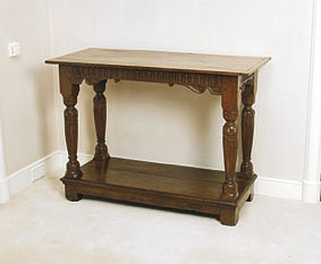 Appraisal: A Jacobean carved oak two tier side table English Circa