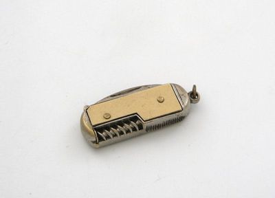 Appraisal: A novelty base metal vesta case modelled as a penknife