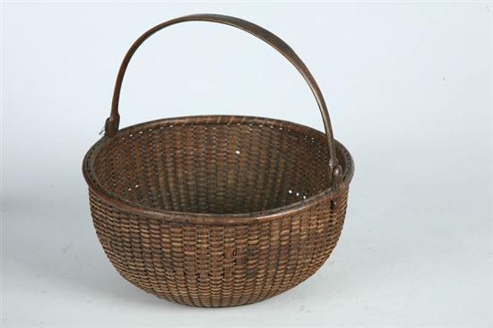 Appraisal: NANTUCKET BASKET Massachusetts early th century Round basket with shaped