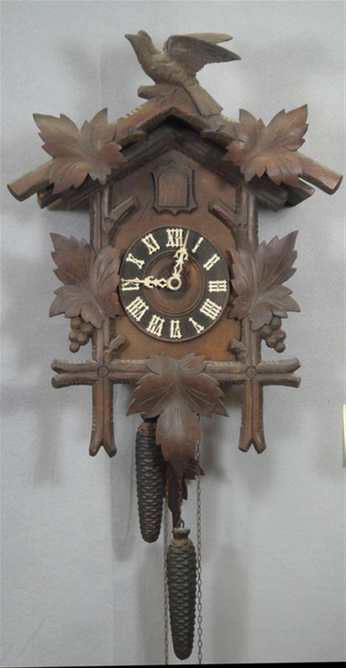 Appraisal: Carved Black Forest cuckoo clock bird grape leaf crest carving