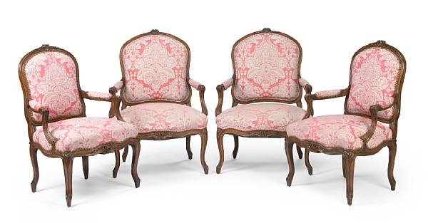 Appraisal: A set of four Louis XV style carved walnut fauteuils