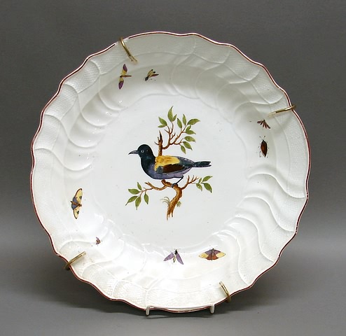 Appraisal: Spiral molded bowl with basketweave band and hand-painted bird on