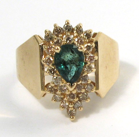 Appraisal: EMERALD DIAMOND AND FOURTEEN KARAT GOLD RING centering a pear-cut