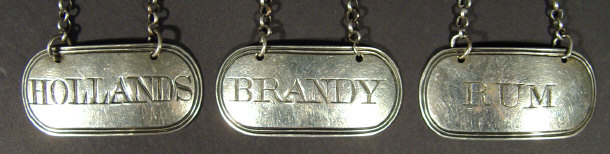 Appraisal: Set of three Georgian silver decanter labels engraved 'Brandy' 'Rum'