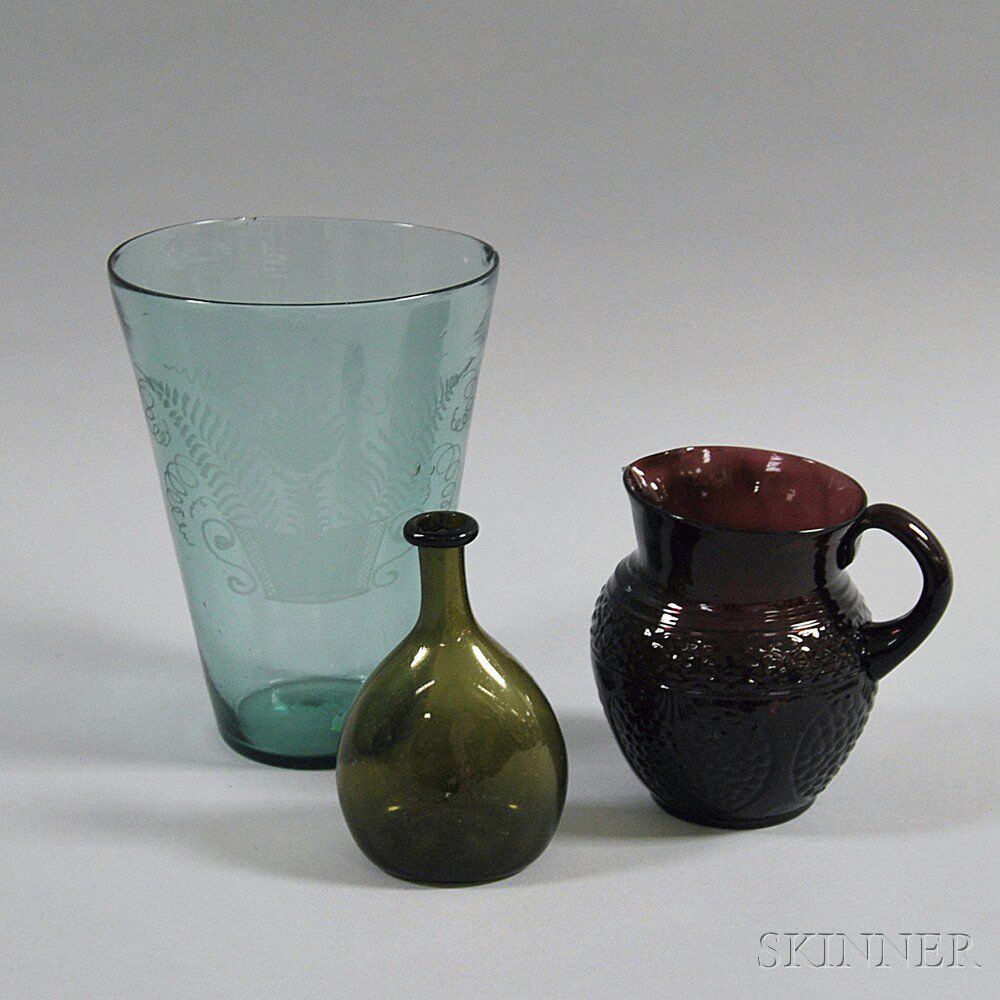 Appraisal: Three Early Glass Vessels th century an amethyst mold-blown pitcher