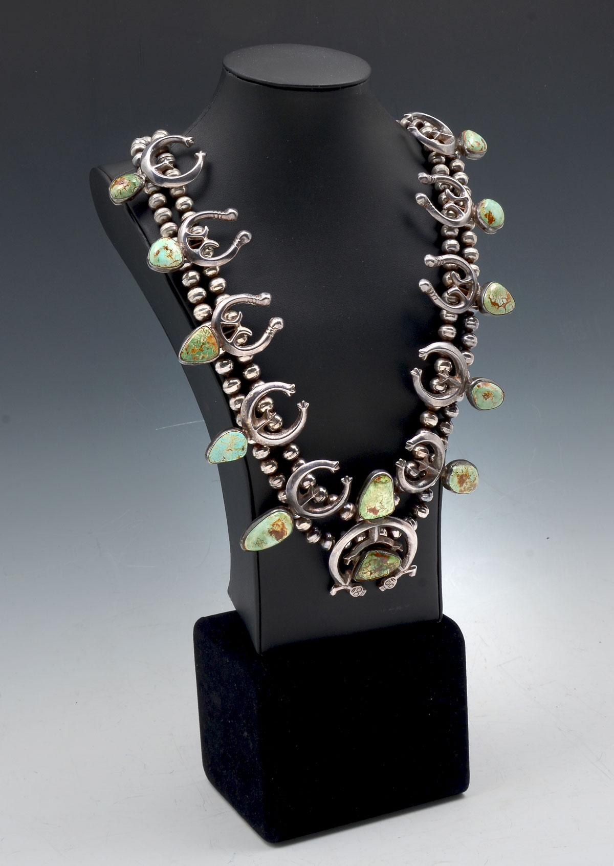 Appraisal: GREEN TURQUOISE STERLING SQUASH BLOSSOM Well-crafted squash blossom necklace with