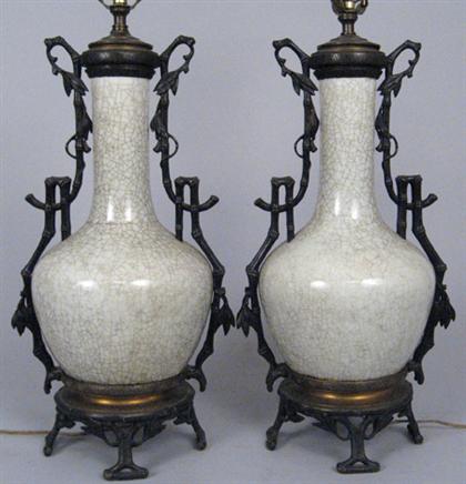 Appraisal: Pair of Chinese Ge-type glazed mounted vases The slender neck