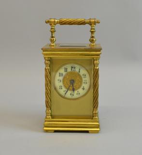 Appraisal: Brass and glass carriage clock with drum movement cm high