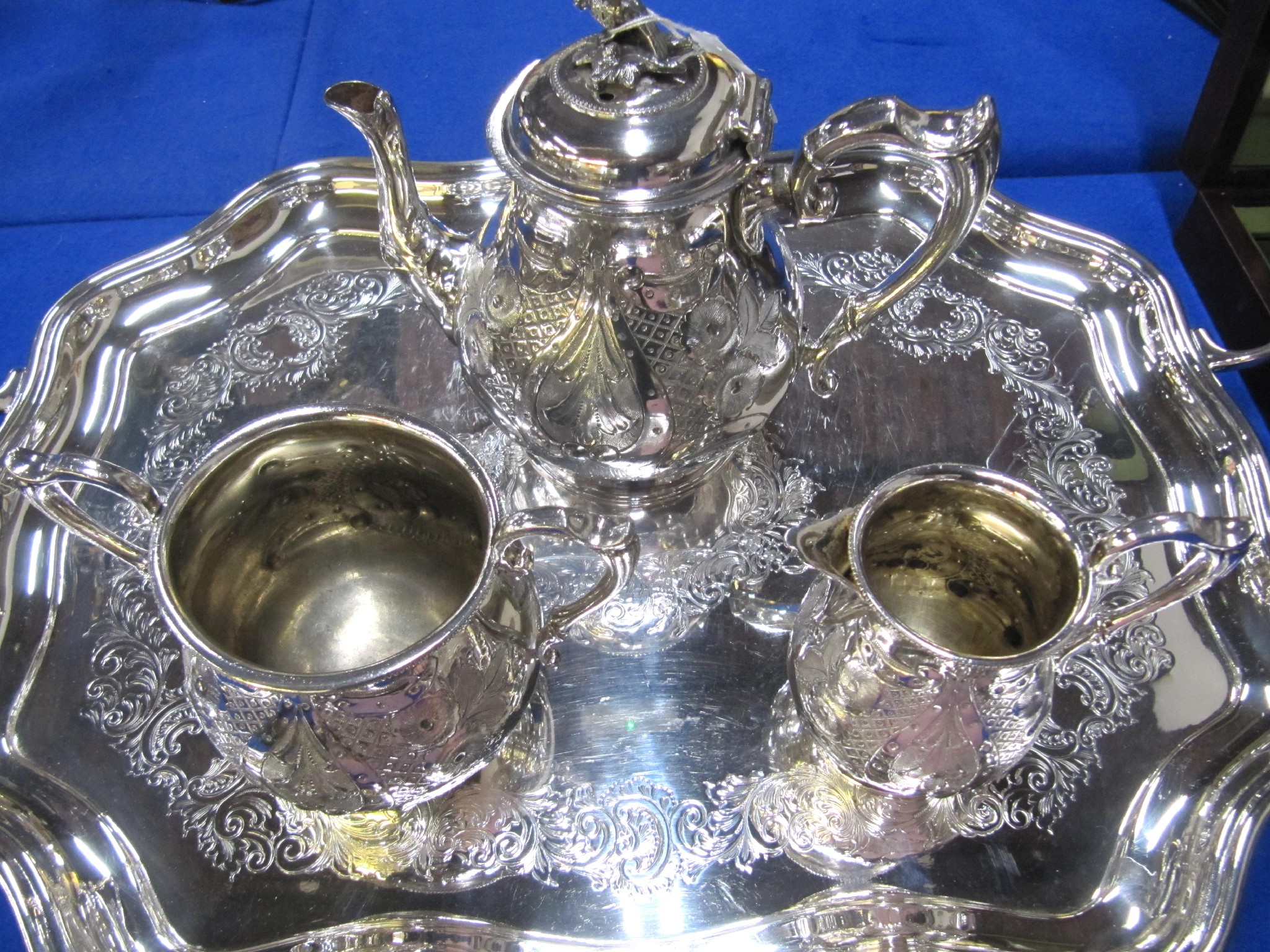 Appraisal: A lot comprising a three piece silver plated tea service