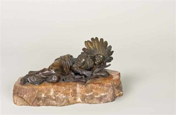 Appraisal: CARL KAUBA Austrian - ''Reclining Indian Smoking a Pipe'' bronze