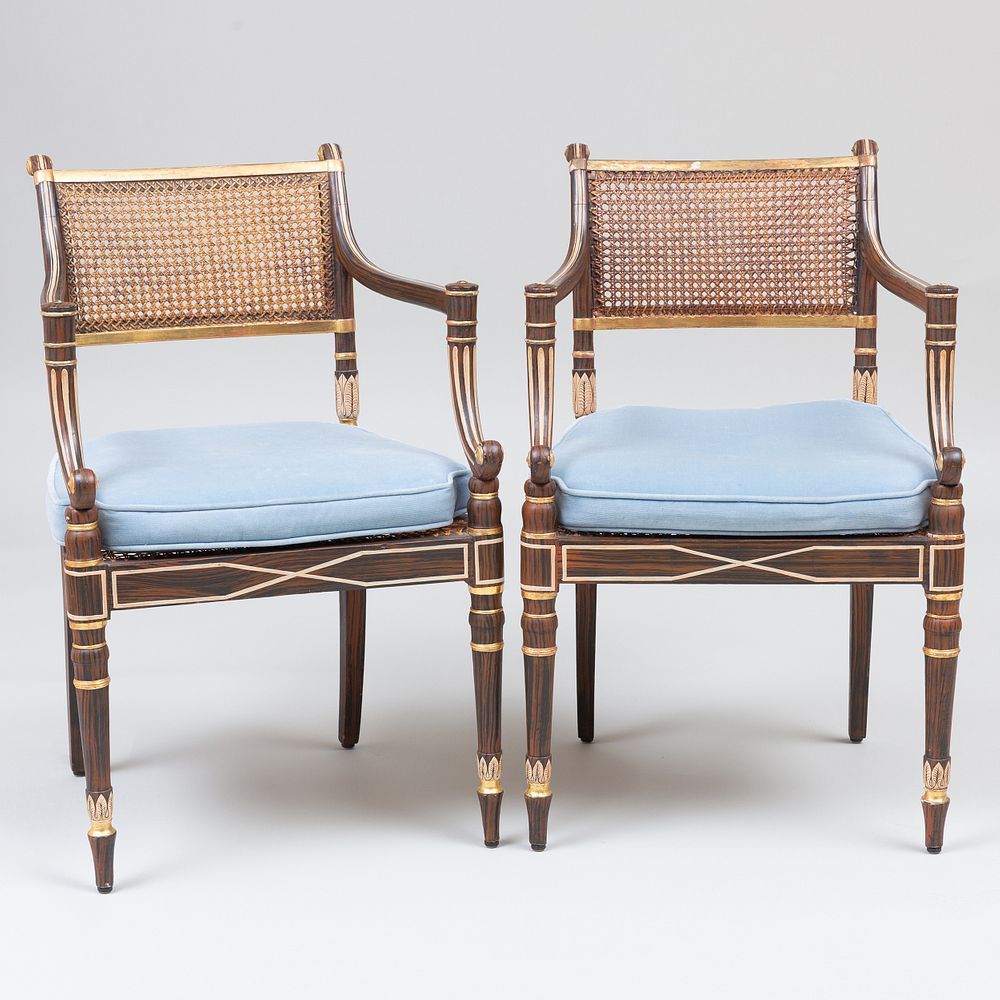 Appraisal: Pair of Regency Painted and Parcel-Gilt Armchairs With caned seats