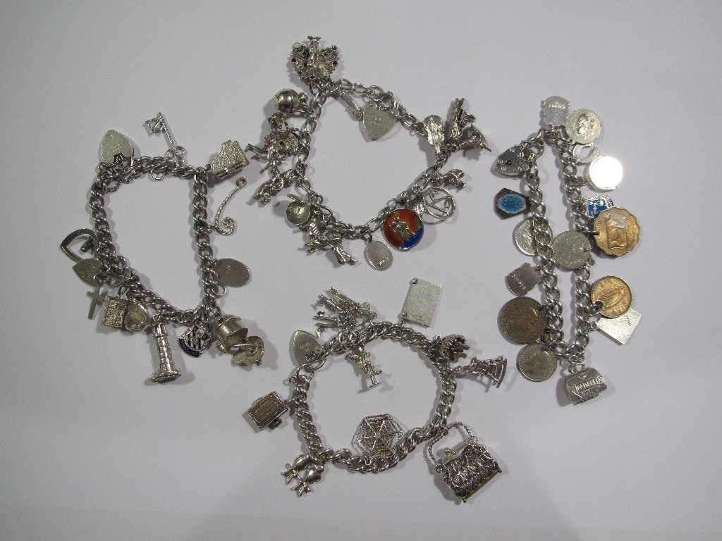 Appraisal: Four silver charm bracelets