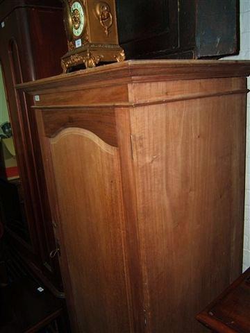 Appraisal: An Arts and Crafts style mahogany wardrobe with single drawer