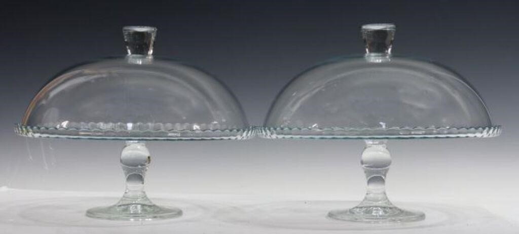 Appraisal: pair Colorless glass cake stands each with scalloped rims and