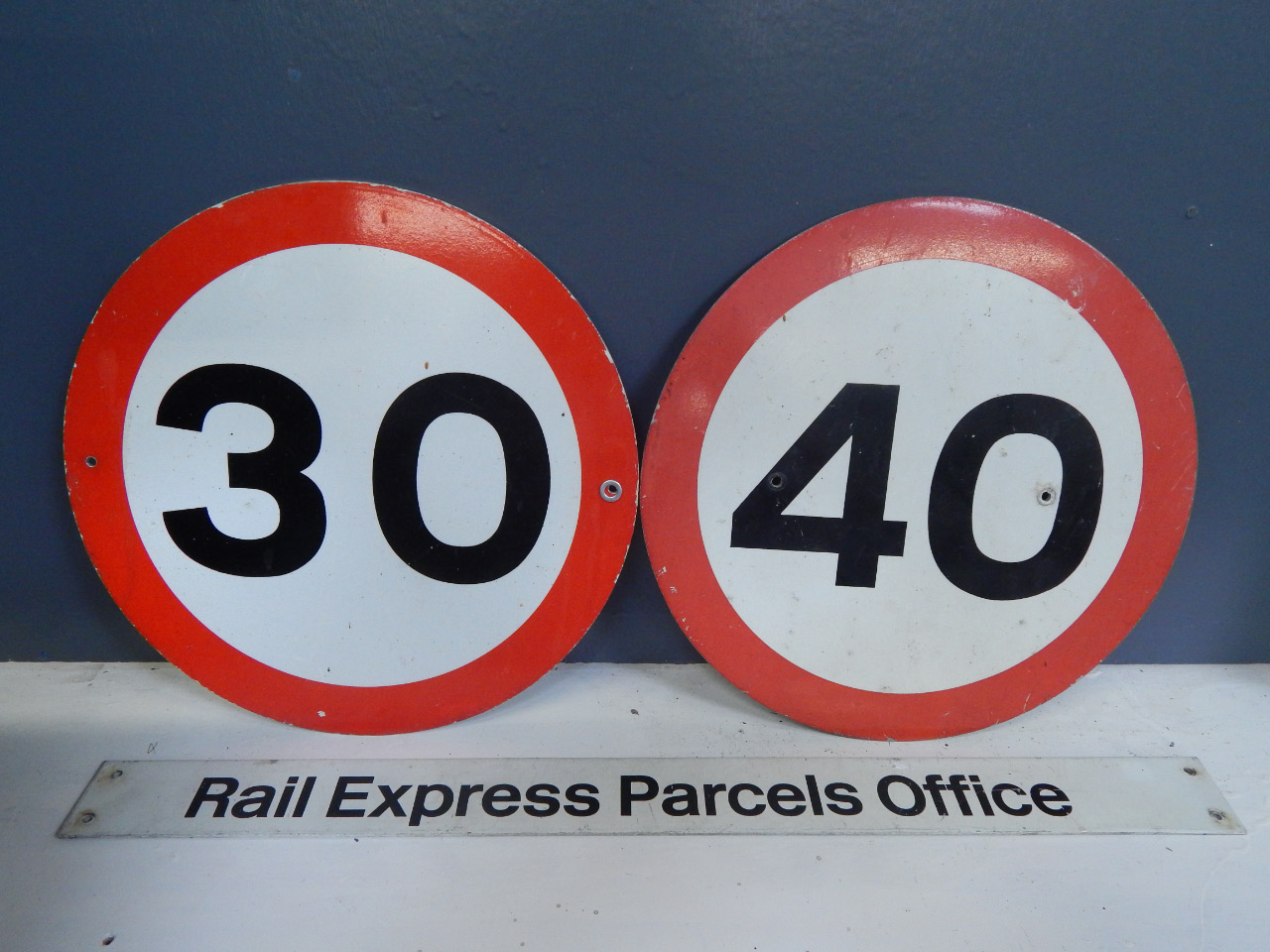 Appraisal: A metalised Rail Express Parcels Office sign with a Mile