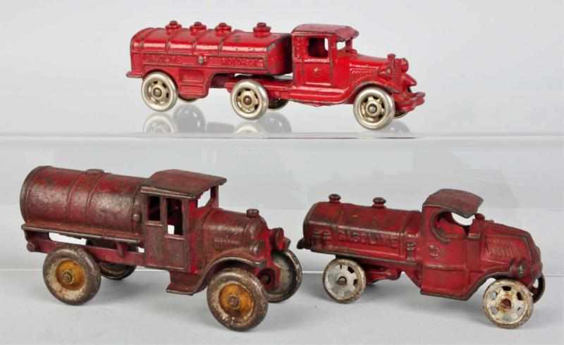 Appraisal: Lot of Cast Iron Gasoline Trucks American Includes one tractor