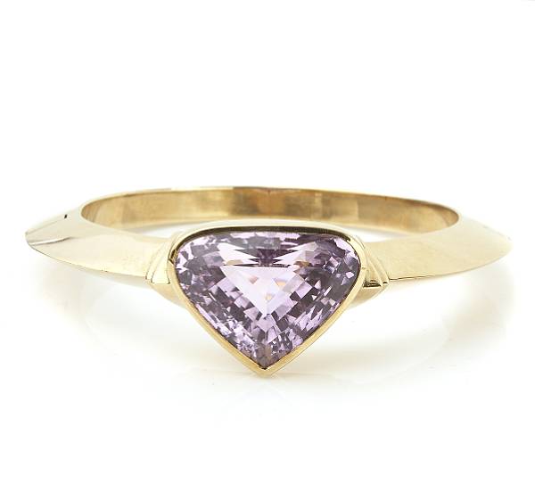 Appraisal: A kunzite bangle bracelet featuring a triangular-shaped kunzite measuring approximately