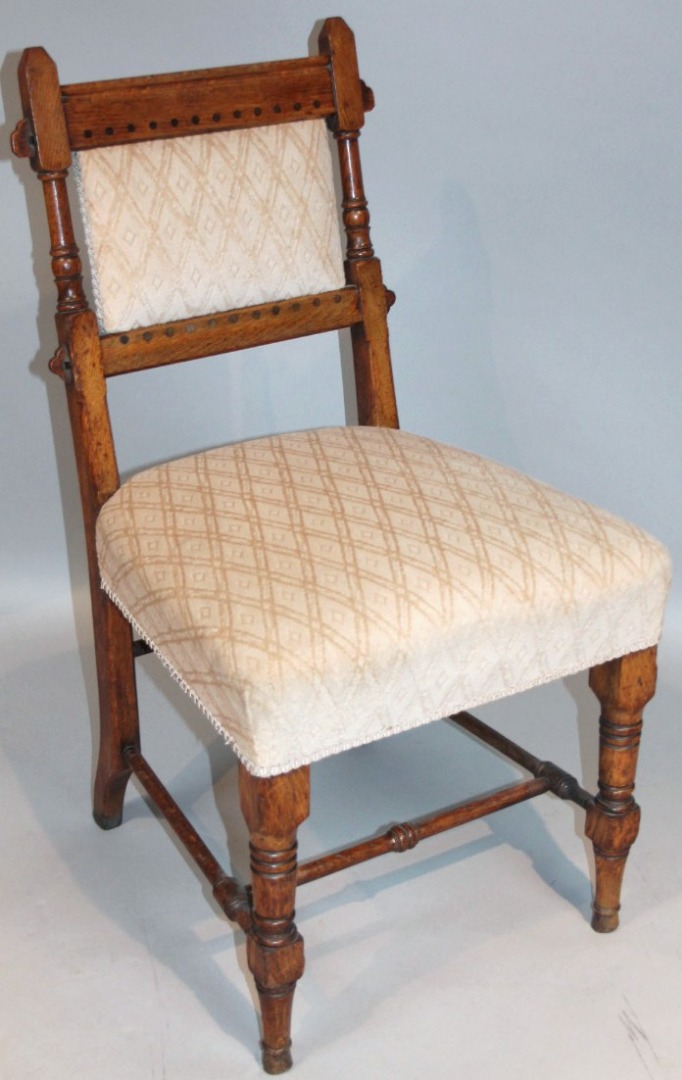 Appraisal: A thC oak arts and crafts hall chair by Gillows