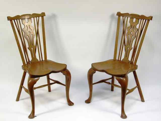 Appraisal: A set of four Windsor type dining chairs on cabriole