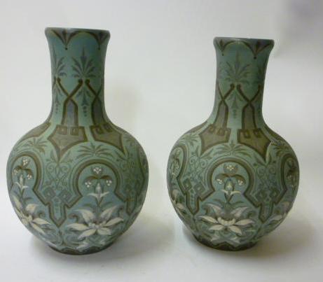 Appraisal: A PAIR OF DOULTON LAMBETH BOTTLE VASES designed by Eliza