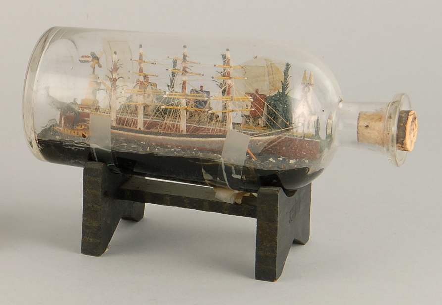 Appraisal: SHIP-IN-A-BOTTLE th CenturyContaining a four-masted bark on a painted sea