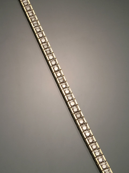 Appraisal: -Karat Yellow-Gold and Diamond Tennis Bracelet Having fifty-three round brilliant-cut