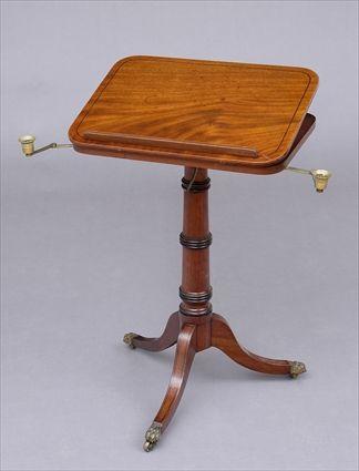 Appraisal: REGENCY BRASS-MOUNTED EBONY-INLAID READING TABLE The hinged top with removable