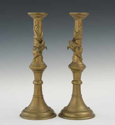 Appraisal: A Pair of Oriental Dragon Candlesticks The pair of brass