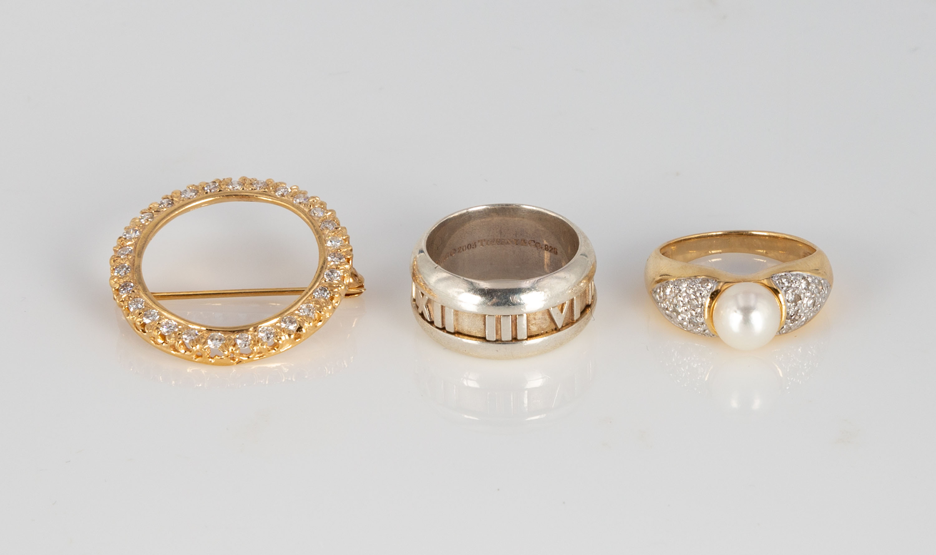 Appraisal: GOLD RINGS AND GOLD AND DIAMOND PIN Left Gold and