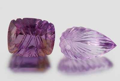 Appraisal: Two Unmounted Concave Cut Amethysts Carat Cushion concave cut and