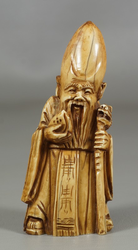 Appraisal: Carved ivory figure of a scribe some age splits We