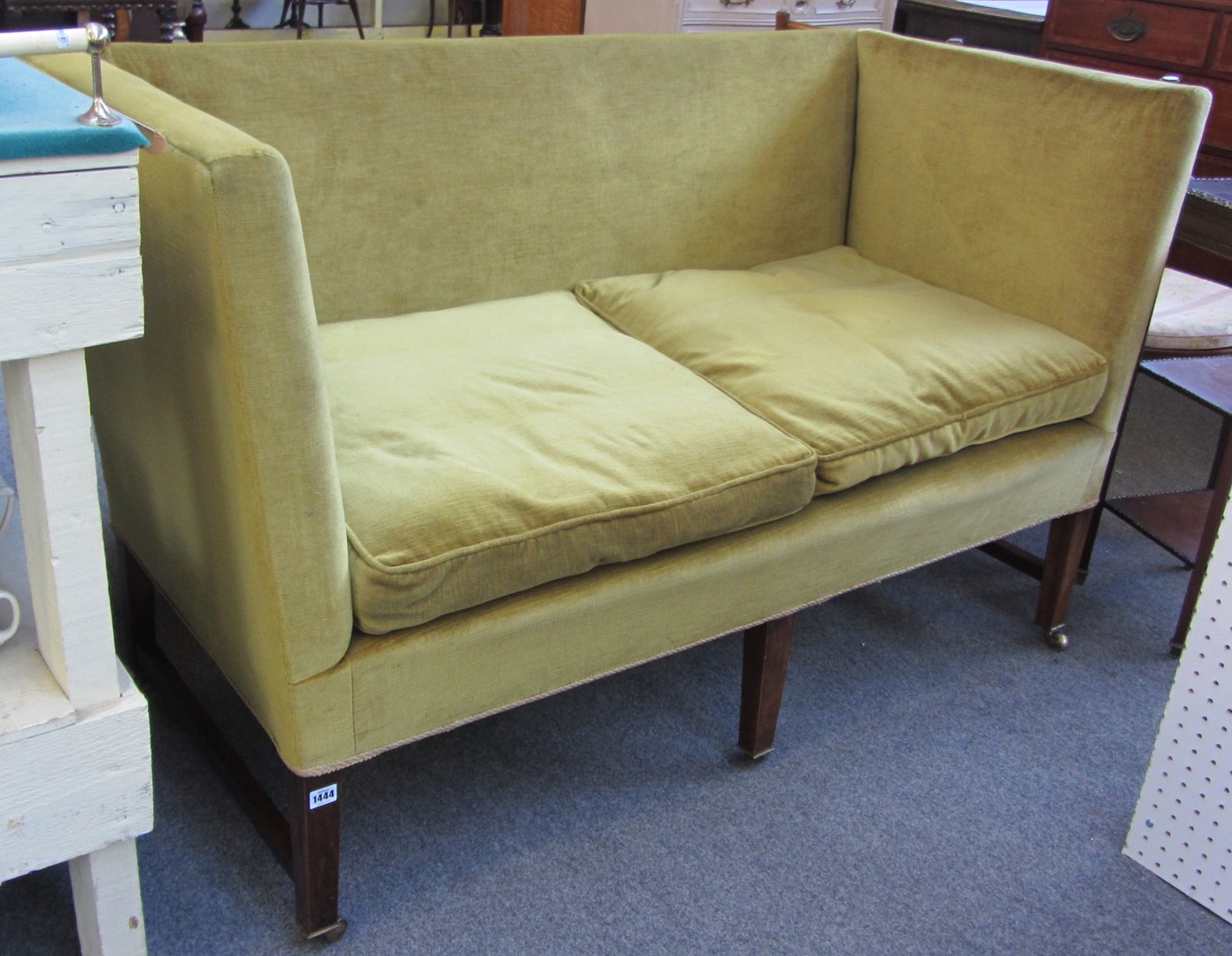 Appraisal: An th century design square backed sofa on five block