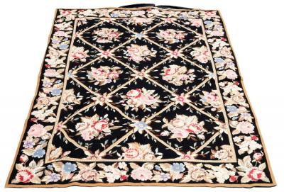 Appraisal: A modern needlepoint rug decorated roses among trellis on a