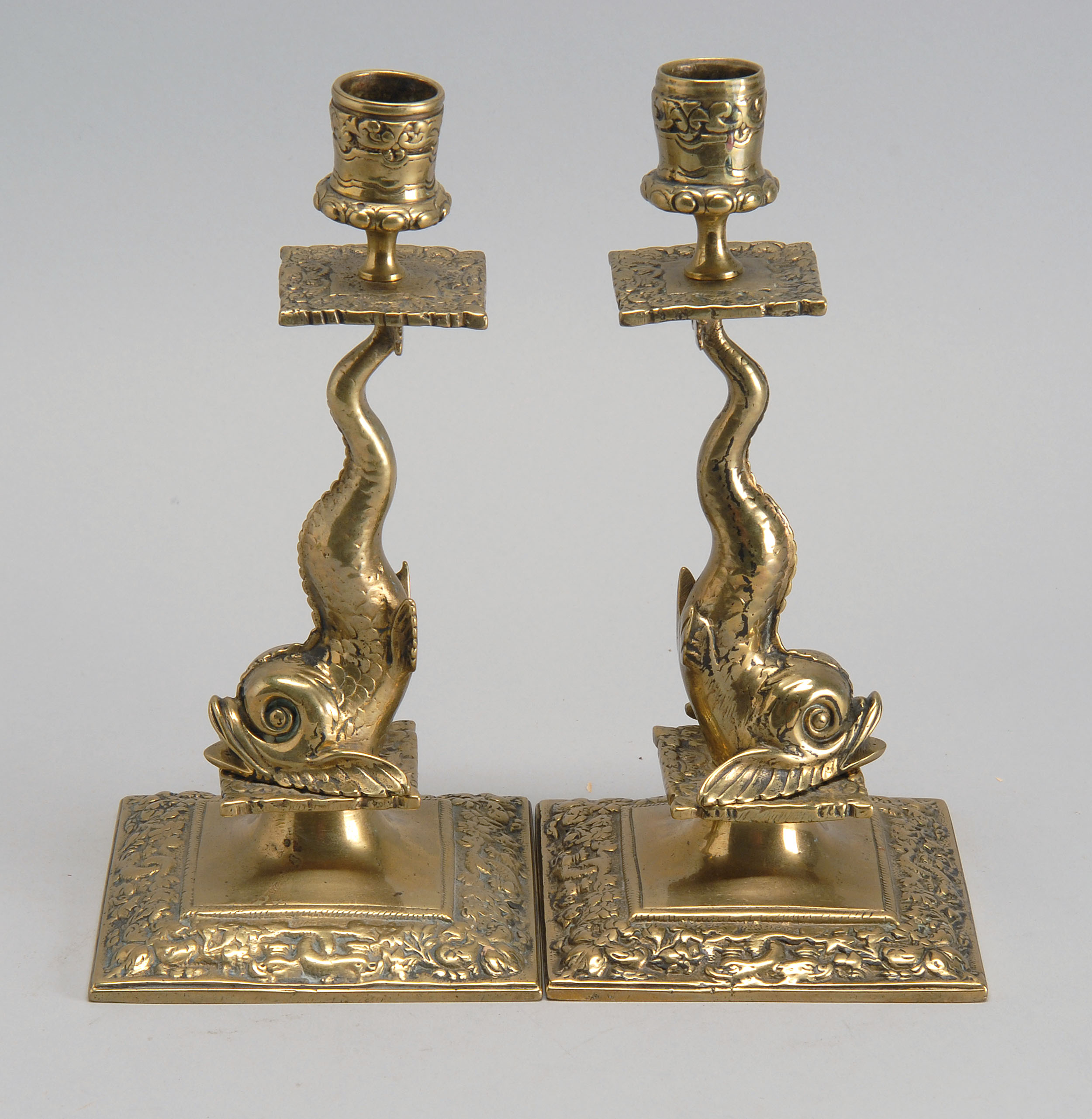 Appraisal: PAIR OF LATE TH EARLY TH CENTURY BRASS DOLPHIN-FORM CANDLESTICKS